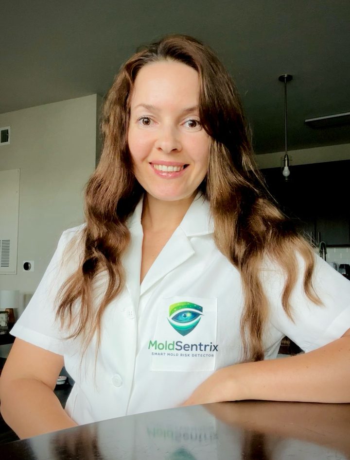 Inha Ushakova, founder of MoldSentrix, wearing a MoldSentrix lab coat